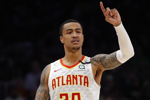 Atlanta Hawks forward John Collins (20) reacts in the second half of an NBA basketball game against the Boston Celtics on Monday, Feb. 3, 2020, in Atlanta. (AP Photo/Todd Kirkland) Atlanta Hawks forward John Collins (20) reacts in the second half of an NBA basketball game against the Boston Celtics on Monday, Feb. 3, 2020, in Atlanta. (AP Photo/Todd Kirkland)
