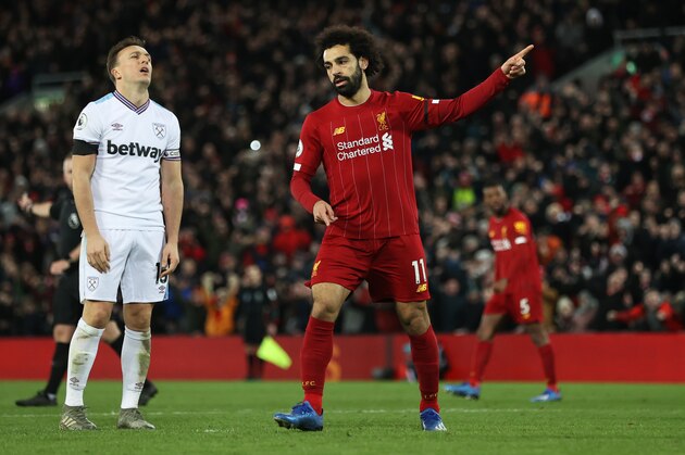 LIVERPOOL, ENGLAND - FEBRUARY 24: Mohamed Salah of Liverpool celebrates after scoring his sides second goal during the Premier League match between Liverpool FC and West Ham United at Anfield on February 24, 2020 in Liverpool, United Kingdom. (Photo by Clive Brunskill/Getty Images)