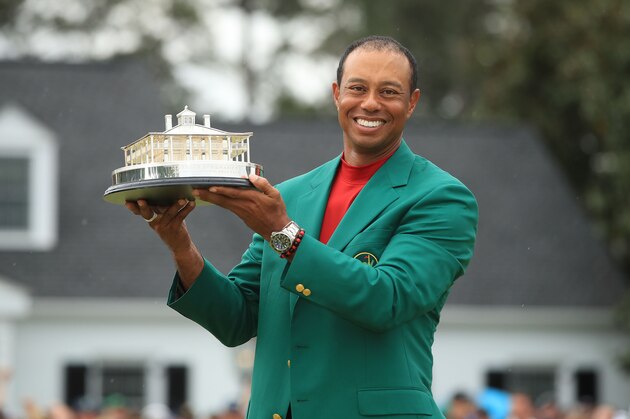 AUGUSTA, GEORGIA - APRIL 14: Tiger Woods of the United States celebrates with the Masters Trophy during the Green Jacket Ceremony after winning the Masters at Augusta National Golf Club on April 14, 2019 in Augusta, Georgia. (Photo by Andrew Redington/Getty Images)