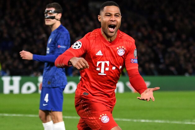 LONDON, ENGLAND - FEBRUARY 25: Serge Gnabry of Bayern Munich celebrates after scoring his team's first goal  during the UEFA Champions League round of 16 first leg match between Chelsea FC and FC Bayern Muenchen at Stamford Bridge on February 25, 2020 in London, United Kingdom. (Photo by Mike Hewitt/Getty Images)