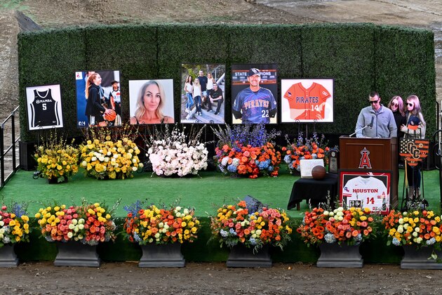 ANAHEIM, CA - FEBRUARY 10: The family of John Altobelli, son JJ Altobelli, his fiance Carly Konigsfeld and daughter Lexi Altobelli, speak during a memorial service honoring their father John, his wife, Keri, and their daughter Alyssa at Angel Stadium of Anaheim on February 10, 2020 in Anaheim, California. The Altobellis were traveling with former Lakers star Kobe Bryant, his 13-year-old daughter Gianna and four others when the helicopter crashed Jan. 26 in foggy conditions, killing everyone on board.(Photo by Jayne Kamin-Oncea/Getty Images)