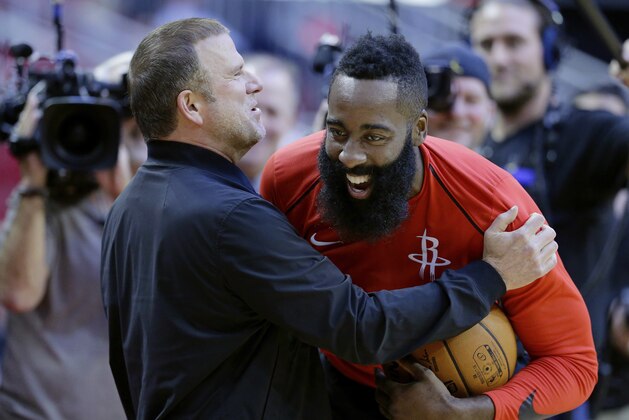 The new owner of the Houston Rockets Tilman Fertitta shares a laugh with his player James Harden before their game against the San Antonio Spurs in an NBA preseason basketball game Friday, Oct. 13, 2017, in Houston. (AP Photo/Michael Wyke)