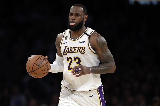 Los Angeles Lakers' LeBron James (23) dribbles down court against the Boston Celtics during the second half of an NBA basketball game Sunday, Feb. 23, 2020, in Los Angeles. (AP Photo/Marcio Jose Sanchez)