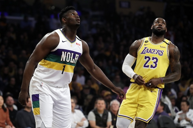 New Orleans Pelicans' Zion Williamson (1) looks on from under the basket during free throws next to Los Angeles Lakers' LeBron James (23) during the first half of an NBA basketball game Tuesday, Feb. 25, 2020, in Los Angeles. (AP Photo/Marcio Jose Sanchez) New Orleans Pelicans' Zion Williamson (1) looks on from under the basket during free throws next to Los Angeles Lakers' LeBron James (23) during the first half of an NBA basketball game Tuesday, Feb. 25, 2020, in Los Angeles. (AP Photo/Marcio Jose Sanchez)