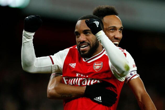 Arsenal's French striker Alexandre Lacazette (L) celebrates with Arsenal's Gabonese striker Pierre-Emerick Aubameyang (R) after scoring their fourth goal during the English Premier League football match between Arsenal and Newcastle United at the Emirates Stadium in London on February 16, 2020. - Arsenal won the game 4-0. (Photo by Ian KINGTON / AFP) / RESTRICTED TO EDITORIAL USE. No use with unauthorized audio, video, data, fixture lists, club/league logos or 'live' services. Online in-match use limited to 120 images. An additional 40 images may be used in extra time. No video emulation. Social media in-match use limited to 120 images. An additional 40 images may be used in extra time. No use in betting publications, games or single club/league/player publications. / (Photo by IAN KINGTON/AFP via Getty Images) Arsenal's French striker Alexandre Lacazette (L) celebrates with Arsenal's Gabonese striker Pierre-Emerick Aubameyang (R) after scoring their fourth goal during the English Premier League football match between Arsenal and Newcastle United at the Emirates Stadium in London on February 16, 2020. - Arsenal won the game 4-0. (Photo by Ian KINGTON / AFP) / RESTRICTED TO EDITORIAL USE. No use with unauthorized audio, video, data, fixture lists, club/league logos or 'live' services. Online in-match use limited to 120 images. An additional 40 images may be used in extra time. No video emulation. Social media in-match use limited to 120 images. An additional 40 images may be used in extra time. No use in betting publications, games or single club/league/player publications. / (Photo by IAN KINGTON/AFP via Getty Images)