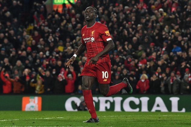 Liverpool's Senegalese striker Sadio Mane celebrates scoring his team's third goal during the English Premier League football match between Liverpool and West Ham United at Anfield in Liverpool, north west England on February 24, 2020. (Photo by Paul ELLIS / AFP) / RESTRICTED TO EDITORIAL USE. No use with unauthorized audio, video, data, fixture lists, club/league logos or 'live' services. Online in-match use limited to 120 images. An additional 40 images may be used in extra time. No video emulation. Social media in-match use limited to 120 images. An additional 40 images may be used in extra time. No use in betting publications, games or single club/league/player publications. /  (Photo by PAUL ELLIS/AFP via Getty Images)