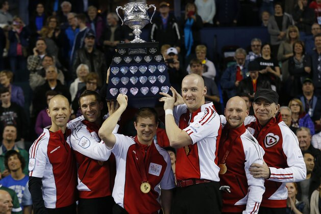 CALGARY, AB - MARCH 8: Team Canada skip Pat Simmons (L-R) third John Morris, second Carter Rycroft, lead Nolan Thiessen, alternate Tom Sallows and coach Earl Morris hoist the Tankard trophy after they defeated Northern Ontario in the gold medal game in curling during the Tim Horton's Brier at the Scotiabank Saddledome on March 8, 2015 in Calgary, Alberta, Canada. (Photo by Todd Korol/Getty Images)