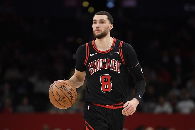 Chicago Bulls guard Zach LaVine (8) dribbles the ball during the first half of an NBA basketball game against the Washington Wizards, Tuesday, Feb. 11, 2020, in Washington. (AP Photo/Nick Wass)