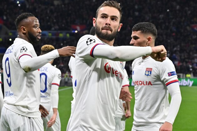 Lyon's French midfielder Lucas Tousart (C) celebrates after scoring a goal  during the UEFA Champions League round of 16 first-leg football match between Lyon and Juventus at the Parc Olympique Lyonnais stadium in Decines-Charpieu, central-eastern France, on February 26, 2020. (Photo by PHILIPPE DESMAZES / AFP) (Photo by PHILIPPE DESMAZES/AFP via Getty Images)