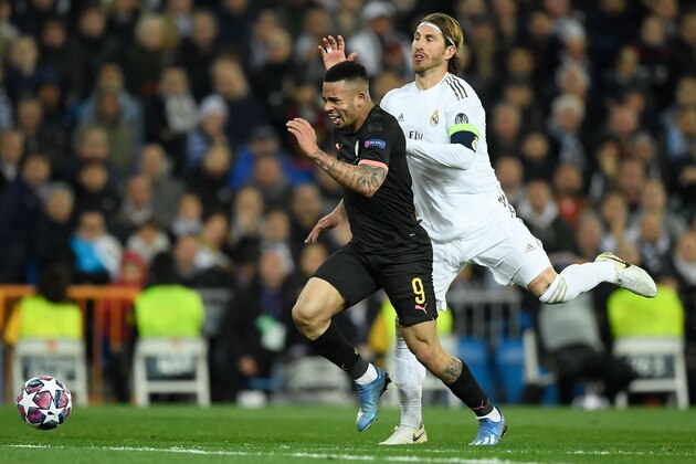 Real Madrid's Spanish defender Sergio Ramos (R) fouls Manchester City's Brazilian striker Gabriel Jesus during the UEFA Champions League round of 16 first-leg football match between Real Madrid CF and Manchester City at the Santiago Bernabeu stadium in Madrid on February 26, 2020. (Photo by OSCAR DEL POZO / AFP) (Photo by OSCAR DEL POZO/AFP via Getty Images)