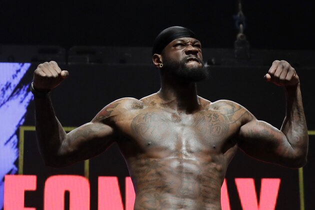 Deontay Wilder stands on the scale during a weigh-in for his WBC heavyweight championship boxing match against Tyson Fury, of England, Friday, Feb. 21, 2020, in Las Vegas. (AP Photo/Isaac Brekken) Deontay Wilder stands on the scale during a weigh-in for his WBC heavyweight championship boxing match against Tyson Fury, of England, Friday, Feb. 21, 2020, in Las Vegas. (AP Photo/Isaac Brekken)