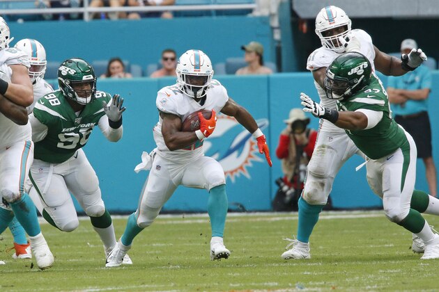 MIAMI GARDENS, FL - NOVEMBER 3: Mark Walton #22 of the Miami Dolphins runs with the ball against the New York Jets during an NFL game on November 3, 2019 at Hard Rock Stadium in Miami Gardens, Florida. The Dolphins defeated the Jets 26-18. (Photo by Joel Auerbach/Getty Images)