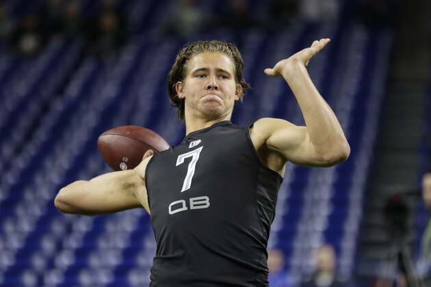Oregon quarterback Justin Herbert runs a drill at the NFL football scouting combine in Indianapolis, Thursday, Feb. 27, 2020. (AP Photo/Michael Conroy)