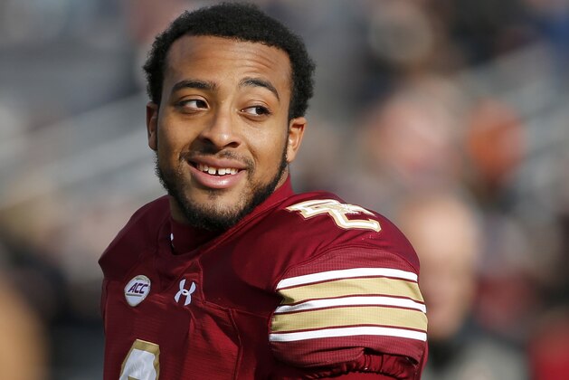 FILE - In this Nov. 24, 2018 file photo, Boston College running back AJ Dillon looks across the field before the start of an NCAA college football game against Syracuse in Boston. (AP Photo/Mary Schwalm, File)