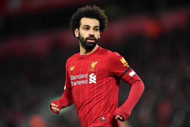 Liverpool's Egyptian midfielder Mohamed Salah reacts during the English Premier League football match between Liverpool and West Ham United at Anfield in Liverpool, north west England on February 24, 2020. (Photo by Paul ELLIS / AFP) / RESTRICTED TO EDITORIAL USE. No use with unauthorized audio, video, data, fixture lists, club/league logos or 'live' services. Online in-match use limited to 120 images. An additional 40 images may be used in extra time. No video emulation. Social media in-match use limited to 120 images. An additional 40 images may be used in extra time. No use in betting publications, games or single club/league/player publications. /  (Photo by PAUL ELLIS/AFP via Getty Images)