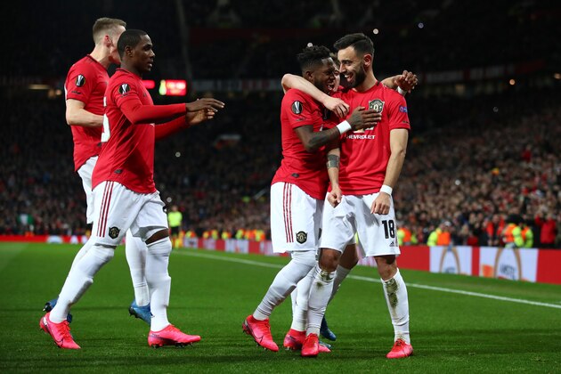 MANCHESTER, ENGLAND - FEBRUARY 27: Bruno Fernandes of Manchester United celebrates with teammates after scoring his team's first goal from the penalty spot during the UEFA Europa League round of 32 second leg match between Manchester United and Club Brugge at Old Trafford on February 27, 2020 in Manchester, United Kingdom. (Photo by Clive Brunskill/Getty Images) MANCHESTER, ENGLAND - FEBRUARY 27: Bruno Fernandes of Manchester United celebrates with teammates after scoring his team's first goal from the penalty spot during the UEFA Europa League round of 32 second leg match between Manchester United and Club Brugge at Old Trafford on February 27, 2020 in Manchester, United Kingdom. (Photo by Clive Brunskill/Getty Images)