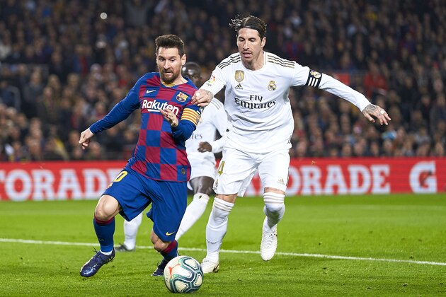 BARCELONA, SPAIN - DECEMBER 18: Lionel Messi of FC Barcelona competes for the ball with Sergio Ramos of Real Madrid during the Liga match between FC Barcelona and Real Madrid CF at Camp Nou on December 18, 2019 in Barcelona, Spain. (Photo by Quality Sport Images/Getty Images)