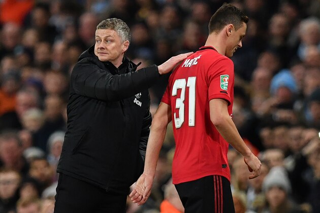 Manchester United's Norwegian manager Ole Gunnar Solskjaer (L) taps Manchester United's Serbian midfielder Nemanja Matic on the shoulder as he is sent off for receiving a red card during the English League Cup semi-final second leg football match between Manchester City and Manchester United at the Etihad Stadium in Manchester, north west England, on January 29, 2020. (Photo by Paul ELLIS / AFP) / RESTRICTED TO EDITORIAL USE. No use with unauthorized audio, video, data, fixture lists, club/league logos or 'live' services. Online in-match use limited to 120 images. An additional 40 images may be used in extra time. No video emulation. Social media in-match use limited to 120 images. An additional 40 images may be used in extra time. No use in betting publications, games or single club/league/player publications. / (Photo by PAUL ELLIS/AFP via Getty Images) Manchester United's Norwegian manager Ole Gunnar Solskjaer (L) taps Manchester United's Serbian midfielder Nemanja Matic on the shoulder as he is sent off for receiving a red card during the English League Cup semi-final second leg football match between Manchester City and Manchester United at the Etihad Stadium in Manchester, north west England, on January 29, 2020. (Photo by Paul ELLIS / AFP) / RESTRICTED TO EDITORIAL USE. No use with unauthorized audio, video, data, fixture lists, club/league logos or 'live' services. Online in-match use limited to 120 images. An additional 40 images may be used in extra time. No video emulation. Social media in-match use limited to 120 images. An additional 40 images may be used in extra time. No use in betting publications, games or single club/league/player publications. / (Photo by PAUL ELLIS/AFP via Getty Images)