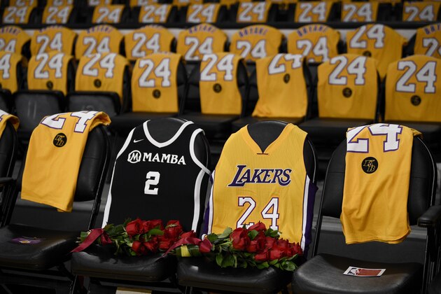 The jerseys of late Los Angeles Laker Kobe Bryant, right, and his daughter Gianna are draped on the seats the two last sat on at Staples Center, prior to the Lakers' NBA basketball game against the Portland Trail Blazers in Los Angeles, Friday, Jan. 31, 2020. The last game two attended was on Dec. 29, 2019 when the Lakers faced the Dallas Mavericks. (AP Photo/Kelvin Kuo)