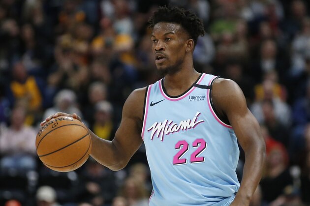 Miami Heat forward Jimmy Butler (22) brings the ball up court in the first half during an NBA basketball game against the Utah Jazz Wednesday, Feb. 12, 2020, in Salt Lake City. (AP Photo/Rick Bowmer)