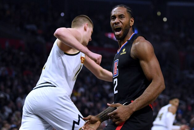 LOS ANGELES, CALIFORNIA - FEBRUARY 28: Kawhi Leonard #2 of the LA Clippers calls for a foul behind Nikola Jokic #15 of the Denver Nuggets during the first half at Staples Center on February 28, 2020 in Los Angeles, California. (Photo by Harry How/Getty Images) LOS ANGELES, CALIFORNIA - FEBRUARY 28: Kawhi Leonard #2 of the LA Clippers calls for a foul behind Nikola Jokic #15 of the Denver Nuggets during the first half at Staples Center on February 28, 2020 in Los Angeles, California. (Photo by Harry How/Getty Images)
