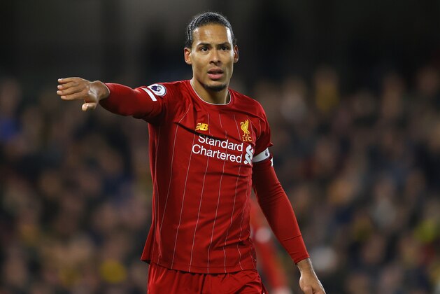 WATFORD, ENGLAND - FEBRUARY 29: Virgil van Dijk of Liverpool signals to a team mate during the Premier League match between Watford FC and Liverpool FC at Vicarage Road on February 29, 2020 in Watford, United Kingdom. (Photo by Richard Heathcote/Getty Images)