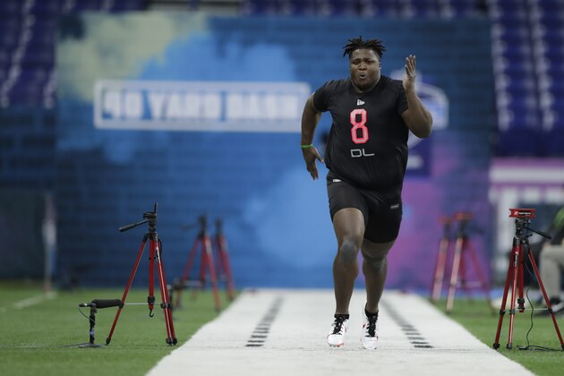 Nebraska defensive lineman Khalil Davis runs the 40-yard dash at the NFL football scouting combine in Indianapolis, Saturday, Feb. 29, 2020. (AP Photo/Michael Conroy)