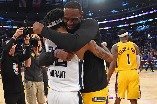 LOS ANGELES, CA - FEBRUARY 21: Ja Morant #12 of the Memphis Grizzlies hugs LeBron James #23 of the Los Angeles Lakers after the game on February 21, 2020 at STAPLES Center in Los Angeles, California. NOTE TO USER: User expressly acknowledges and agrees that, by downloading and/or using this Photograph, user is consenting to the terms and conditions of the Getty Images License Agreement. Mandatory Copyright Notice: Copyright 2020 NBAE (Photo by Adam Pantozzi/NBAE via Getty Images)