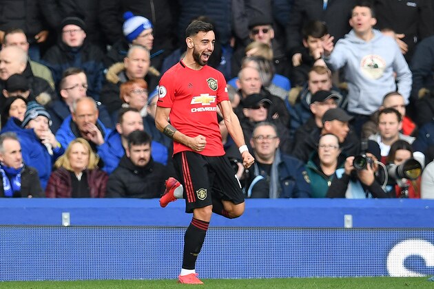 Manchester United's Portuguese midfielder Bruno Fernandes celebrates after scoring the equalising goal during the English Premier League football match between Everton and Manchester United at Goodison Park in Manchester United, north west England on March 1, 2020. (Photo by Paul ELLIS / AFP) / RESTRICTED TO EDITORIAL USE. No use with unauthorized audio, video, data, fixture lists, club/league logos or 'live' services. Online in-match use limited to 120 images. An additional 40 images may be used in extra time. No video emulation. Social media in-match use limited to 120 images. An additional 40 images may be used in extra time. No use in betting publications, games or single club/league/player publications. /  (Photo by PAUL ELLIS/AFP via Getty Images)