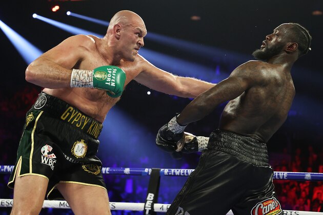 LAS VEGAS, NEVADA - FEBRUARY 22:  Tyson Fury punches Deontay Wilder during their Heavyweight bout for Wilder's WBC and Fury's lineal heavyweight title on February 22, 2020 at MGM Grand Garden Arena in Las Vegas, Nevada. (Photo by Al Bello/Getty Images)