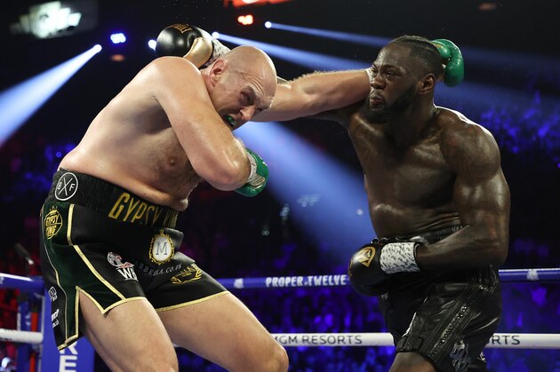 LAS VEGAS, NEVADA - FEBRUARY 22:  Deontay Wilder punches Tyson Fury during their Heavyweight bout for Wilder's WBC and Fury's lineal heavyweight title on February 22, 2020 at MGM Grand Garden Arena in Las Vegas, Nevada. (Photo by Al Bello/Getty Images)