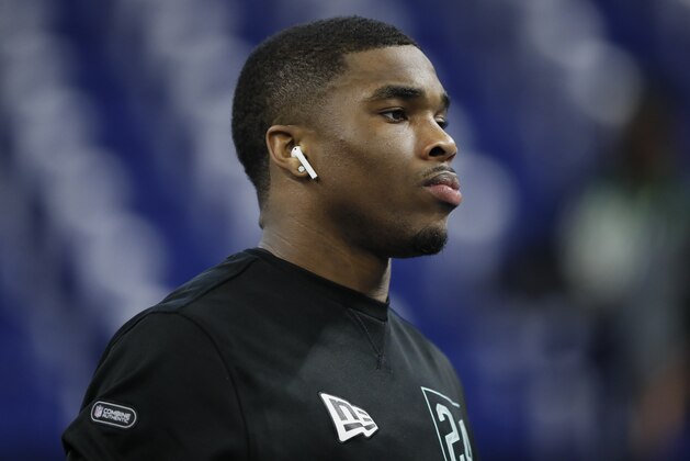 Ohio State defensive back Jeff Okudah watches the 40-yard dash at the NFL football scouting combine in Indianapolis, Sunday, March 1, 2020. (AP Photo/Charlie Neibergall)