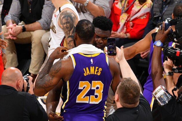 NEW ORLEANS, LA - MARCH 1: Zion Williamson #1 of the New Orleans Pelicans hugs LeBron James #23 of the Los Angeles Lakers after the game on March 1, 2020 at the Smoothie King Center in New Orleans, Louisiana. NOTE TO USER: User expressly acknowledges and agrees that, by downloading and or using this Photograph, user is consenting to the terms and conditions of the Getty Images License Agreement. Mandatory Copyright Notice: Copyright 2020 NBAE (Photo by Jesse D. Garrabrant/NBAE via Getty Images)