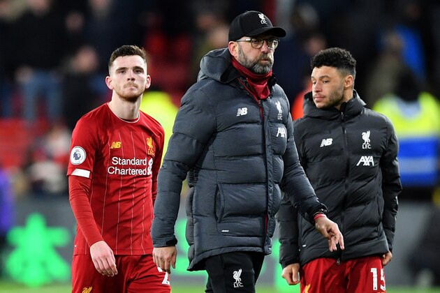 Liverpool's German manager Jurgen Klopp (C), Liverpool's Scottish defender Andrew Robertson (L) and Liverpool's English midfielder Alex Oxlade-Chamberlain react at the final whistle during the English Premier League football match between Watford and Liverpool at Vicarage Road Stadium in Watford, north of London on February 29, 2020. (Photo by Justin TALLIS / AFP) / RESTRICTED TO EDITORIAL USE. No use with unauthorized audio, video, data, fixture lists, club/league logos or 'live' services. Online in-match use limited to 120 images. An additional 40 images may be used in extra time. No video emulation. Social media in-match use limited to 120 images. An additional 40 images may be used in extra time. No use in betting publications, games or single club/league/player publications. /  (Photo by JUSTIN TALLIS/AFP via Getty Images)