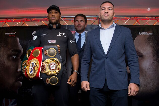 Britain's Anthony Joshua (L) and Bulgaria's Kubrat Pulev (R) and boxing promoter Eddie Hearn (C) pose during a press conference at the Principality Stadium in Cardiff on September 11, 2017 during a promotional event for their heavyweight world title boxing match. 
Britain's Anthony Joshua will defend his IBO, IBF and WBA world heavyweight titles against Bulgaria's Kubrat Pulev at Cardiff's Principality Stadium on October 28.
 / AFP PHOTO / Geoff CADDICK        (Photo credit should read GEOFF CADDICK/AFP via Getty Images)