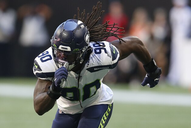 Seattle Seahawks defensive end Jadeveon Clowney (90) breaks off the line of scrimmage in a week 7 NFL football game against the Atlanta Falcons, Sunday, Sep. 27, 2019 in Atlanta. (Michael Zarrilli/AP Images for Panini, via AP)