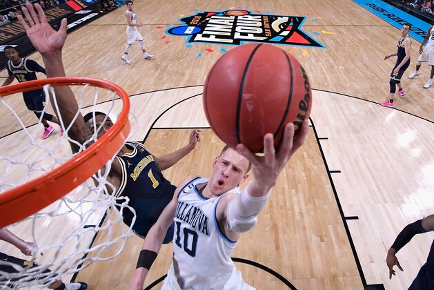 SAN ANTONIO, TX - APRIL 02: Donte DiVincenzo #10 of the Villanova Wildcats drives to the basket against Charles Matthews #1 of the Michigan Wolverines in the second half during the 2018 NCAA Men's Final Four National Championship game at the Alamodome on April 2, 2018 in San Antonio, Texas.  (Photo by Jamie Schwaberow - Pool/Getty Images)