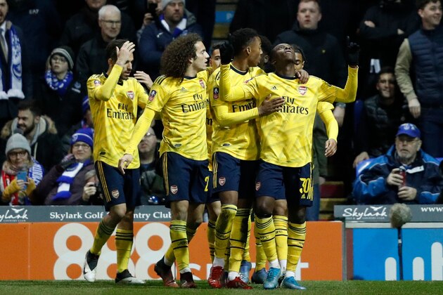 Arsenal's English striker Eddie Nketiah (R) celebrates scoring their second goal during the English FA Cup fifth round football match between Portsmouth and Arsenal at Fratton Park stadium in Portsmouth, southern England, on March 2, 2020. (Photo by Adrian DENNIS / AFP) / RESTRICTED TO EDITORIAL USE. No use with unauthorized audio, video, data, fixture lists, club/league logos or 'live' services. Online in-match use limited to 120 images. An additional 40 images may be used in extra time. No video emulation. Social media in-match use limited to 120 images. An additional 40 images may be used in extra time. No use in betting publications, games or single club/league/player publications. /  (Photo by ADRIAN DENNIS/AFP via Getty Images)