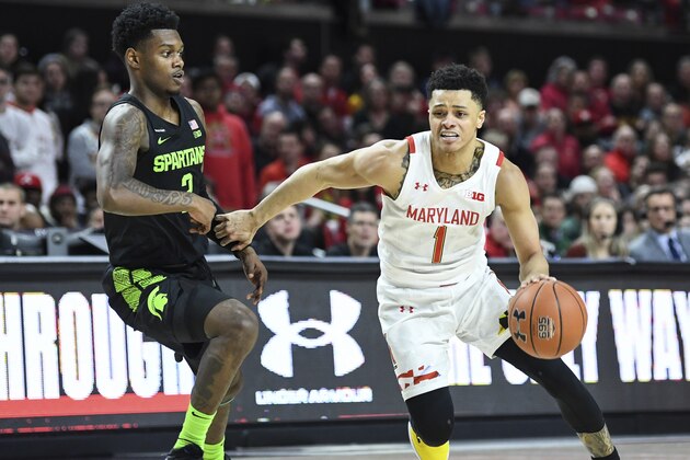 Maryland guard Anthony Cowan Jr. (1) drives to the basket against Michigan State guard Rocket Watts (2) during the second half of an NCAA college basketball game Saturday, Feb. 29, 2020, in College Park, Md. (AP Photo/Terrance Williams)