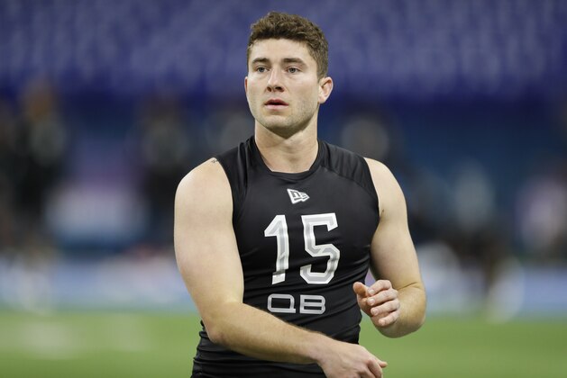 Michigan quarterback Shea Patterson runs a drill at the NFL football scouting combine in Indianapolis, Thursday, Feb. 27, 2020. (AP Photo/Charlie Neibergall)