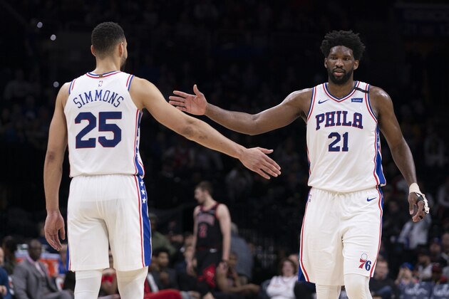 PHILADELPHIA, PA - FEBRUARY 09: Ben Simmons #25 and Joel Embiid #21 of the Philadelphia 76ers react against the Chicago Bulls in the fourth quarter at the Wells Fargo Center on February 9, 2020 in Philadelphia, Pennsylvania. The 76ers defeated the Bulls 118-111. NOTE TO USER: User expressly acknowledges and agrees that, by downloading and/or using this photograph, user is consenting to the terms and conditions of the Getty Images License Agreement. (Photo by Mitchell Leff/Getty Images)