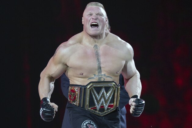 FILE - In this March 29, 2015, file photo, Brock Lesnar makes his entrance at Wrestlemania XXXI in Santa Clara, Calif. WWE is set to hold its Crown Jewel event Friday, Nov. 2, 2018, in Riyadh, Saudi Arabia. The lucrative deal with Saudi Arabia has prompted fans and politicians to criticize WWE's decision to continue with the event. (AP Photo/Don Feria, File)