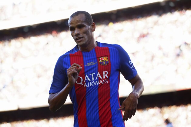 Former FC Barcelona player Rivaldo runs during a friendly soccer match between FC Barcelona legends and Manchester United legends at the Camp Nou stadium in Barcelona, Spain, Friday, June, 30, 2017. (AP Photo/Manu Fernandez)