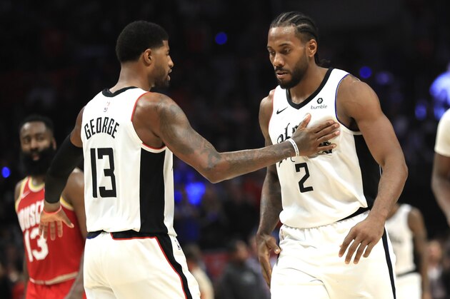 LOS ANGELES, CALIFORNIA - NOVEMBER 22:  Kawhi Leonard #2 is congratulated by Paul George #13 of the Los Angeles Clippers during the second half of a game against the Houston Rockets at Staples Center on November 22, 2019 in Los Angeles, California.  NOTE TO USER: User expressly acknowledges and agrees that, by downloading and/or using this photograph, user is consenting to the terms and conditions of the Getty Images License Agreement (Photo by Sean M. Haffey/Getty Images)