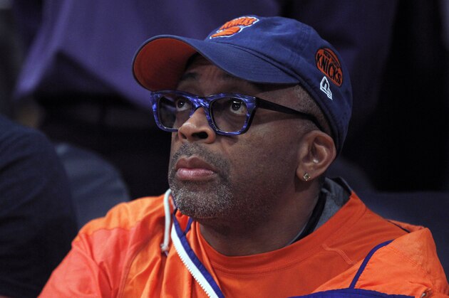 New York Knicks fan and director Spike Lee watches during the first half of an NBA basketball game between the Los Angeles Lakers and the New York Knicks  in Los Angeles, Sunday, March 13, 2016. (AP Photo/Alex Gallardo)