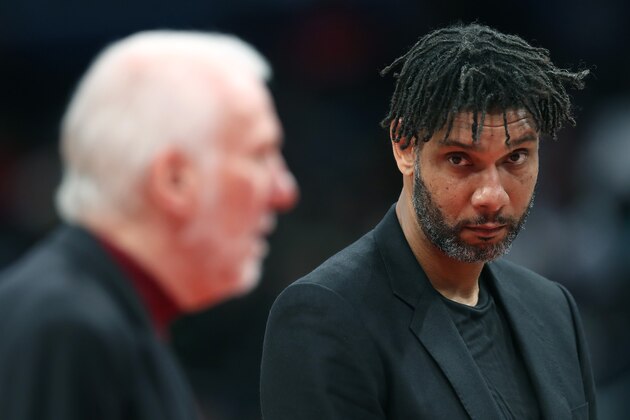 WASHINGTON, DC - NOVEMBER 20: Assistant coach Tim Duncan (R) looks on as head coach Gregg Popovich of the San Antonio Spurs talks with an official in the first half against the Washington Wizards at Capital One Arena on November 20, 2019 in Washington, DC.  NOTE TO USER: User expressly acknowledges and agrees that, by downloading and/or using this photograph, user is consenting to the terms and conditions of the Getty Images License Agreement.  (Photo by Rob Carr/Getty Images)