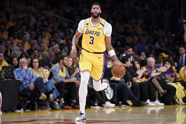 Los Angeles Lakers forward Anthony Davis takes the ball down the court during the second half of an NBA basketball game against the Portland Trail Blazers in Los Angeles, Friday, Jan. 31, 2020. (AP Photo/Kelvin Kuo)
