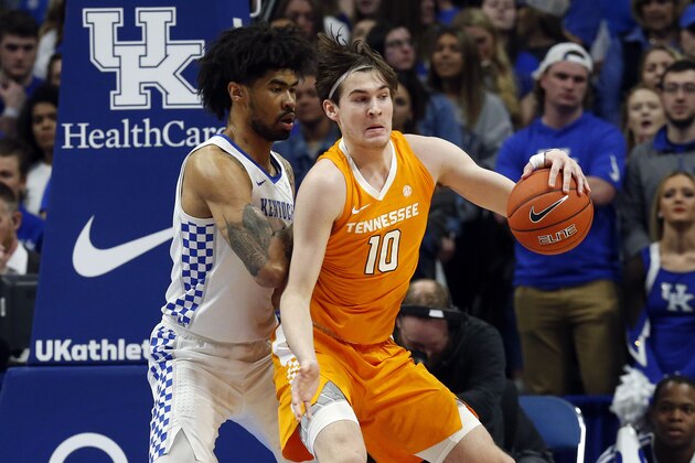 Tennessee's John Fulkerson (10) looks for an opening on Kentucky's Nick Richards, left, during the first half of an NCAA college basketball game, Tuesday, March 3, 2020, in Lexington, Ky. (AP Photo/James Crisp)