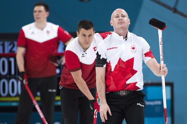Kevin Koe, right, of Canada reacts during men's bronze medal curling finals against Switzerland at the 2018 Olympic Winter Games in Gangneung, South Korea on Friday, February 23, 2018. Switzerland defeated Canada to win the bronze medal. (Nathan Denette/The Canadian Press via AP)