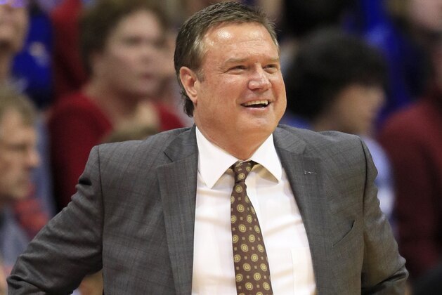 Kansas head coach Bill Self smiles at this team during the second half of an NCAA college basketball game against Iowa State in Lawrence, Kan., Monday, Feb. 17, 2020. Kansas defeated Iowa State 91-71. (AP Photo/Orlin Wagner)